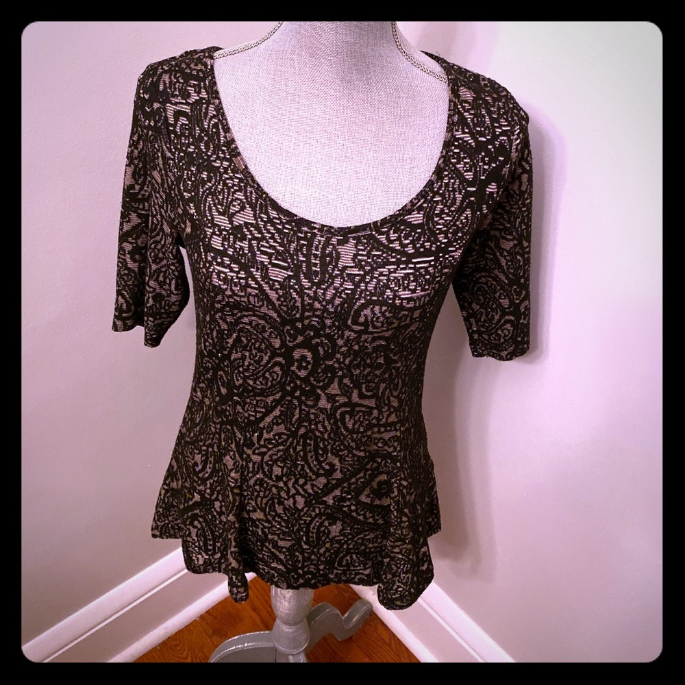 Black with nude under tone peplum top.